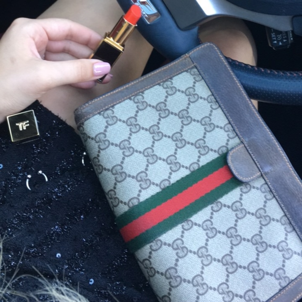 Vintage Gucci monogram coated clutch.
